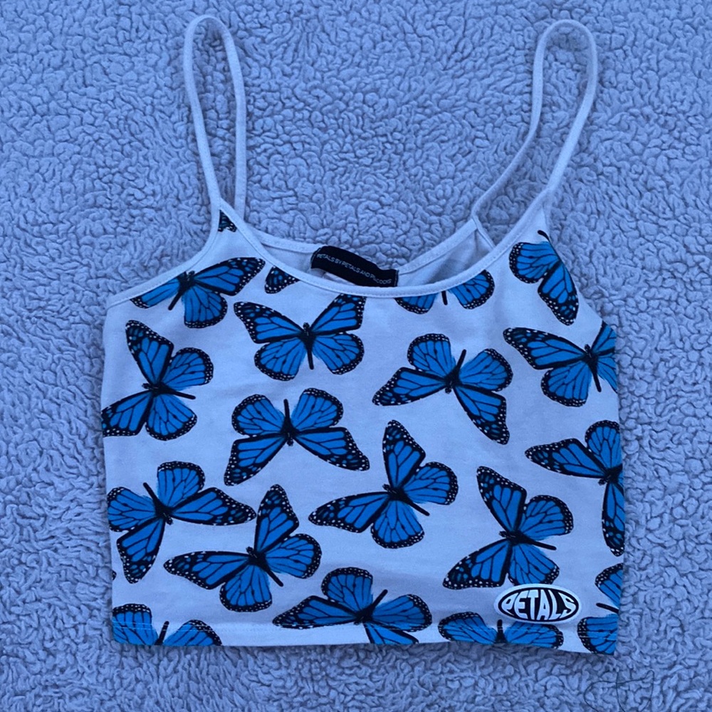 white cropped tank top with blue butterflies